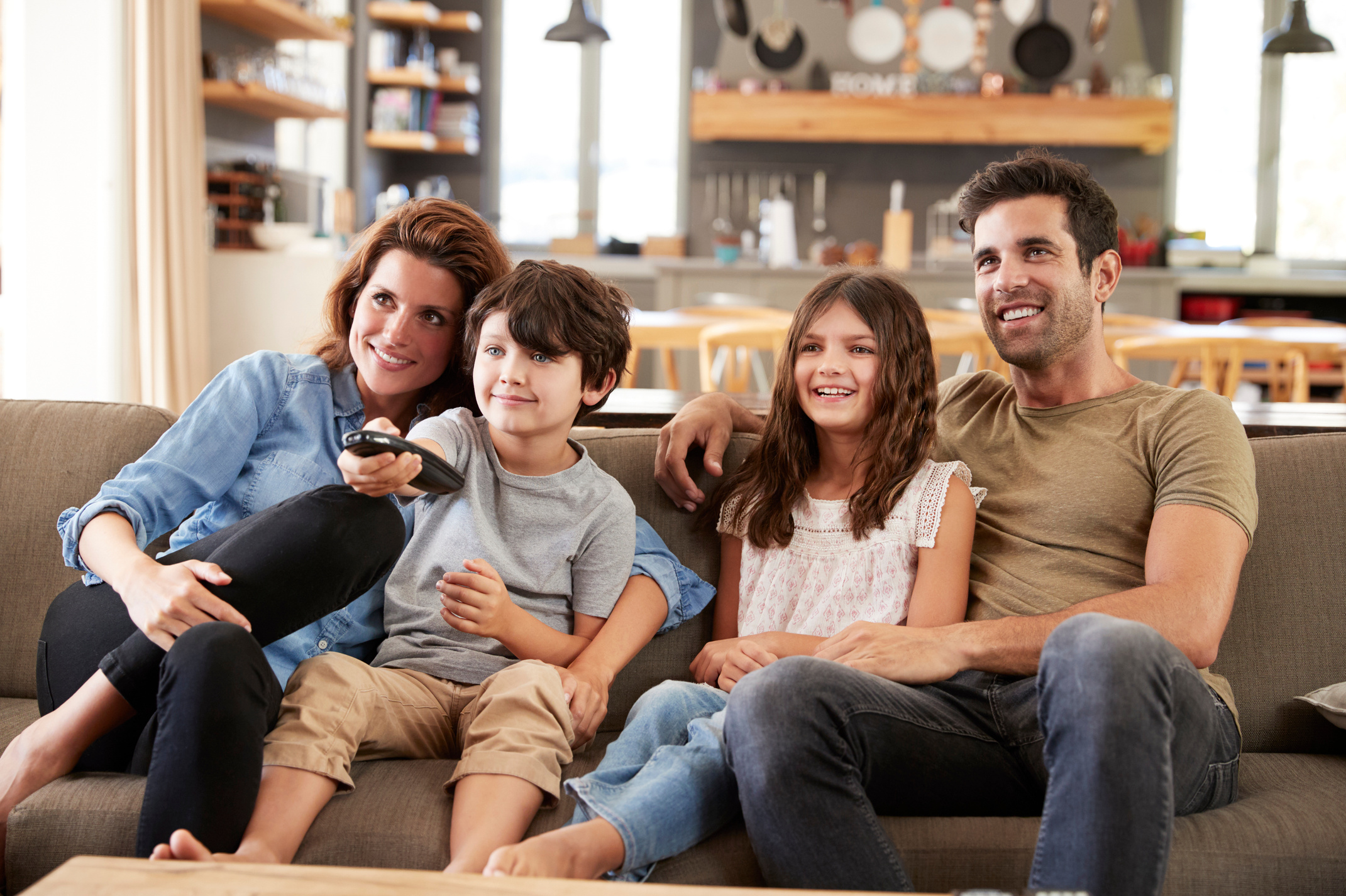 Family Sitting Watching Television
